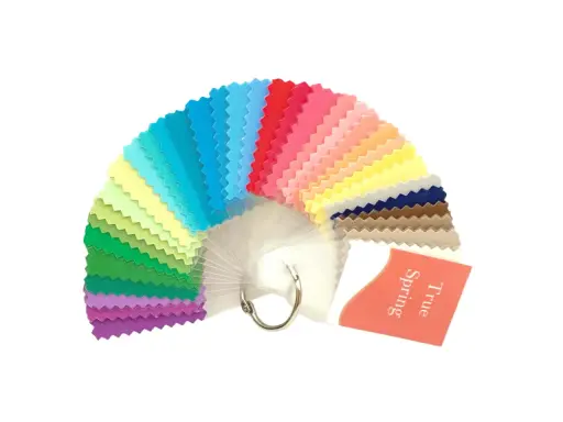 A fan of fabric swatches in various bright colors, with a tag reading "True Spring".