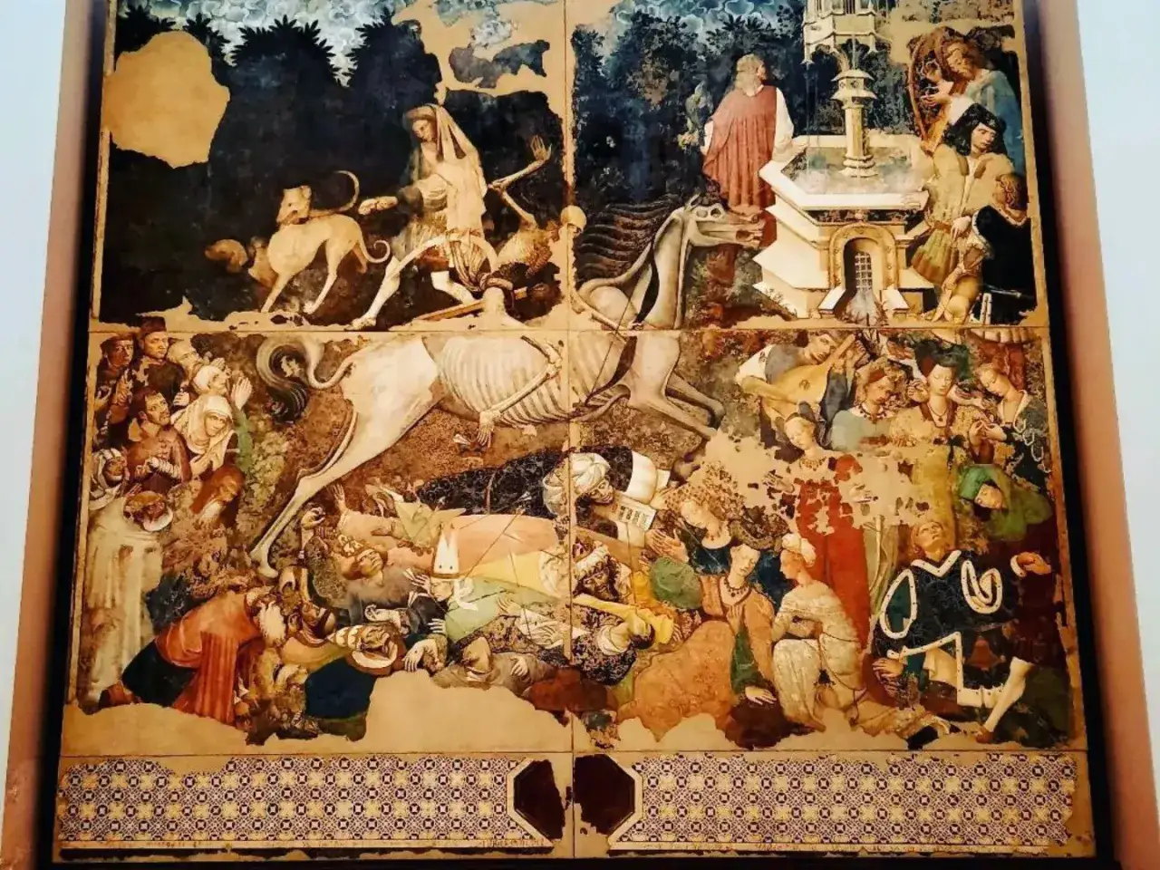 Affresco del Trionfo della Morte, opere di Palazzo Abatellis, con scheletri che cavalcano e travolgono figure umane in un paesaggio desolato.